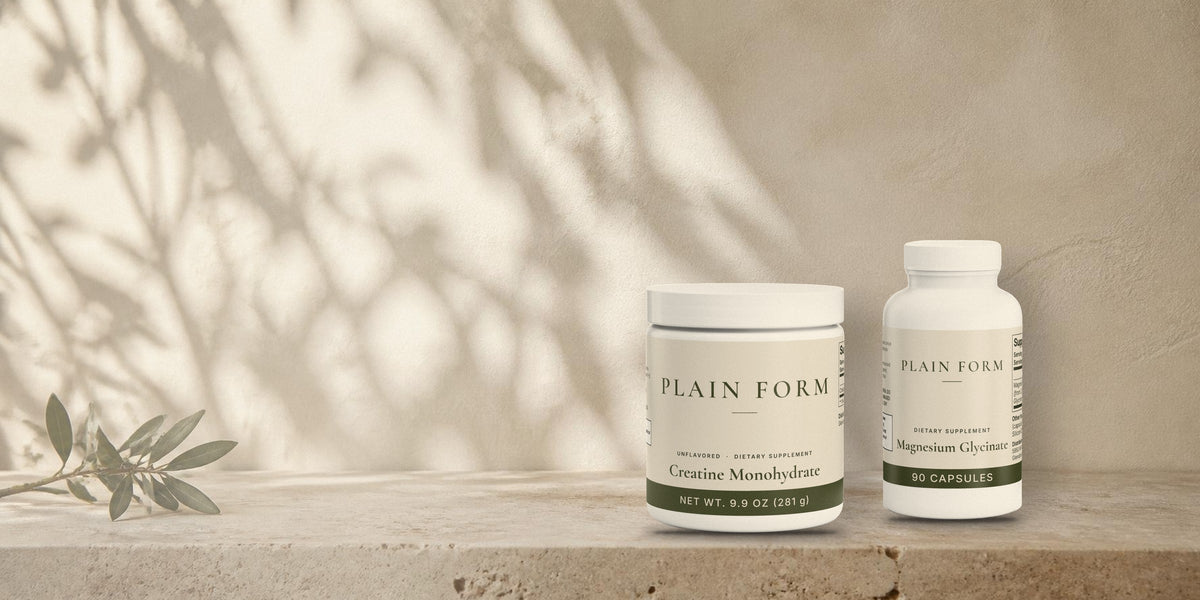 Plain Form Creatine jar and Magnesium bottle on a stone ledge